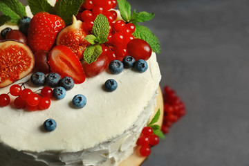 Delicious creamy cake with berries, closeup