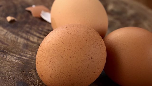 Portion of fresh made Boiled Eggs on a wooden plate (not loopable; 4K)