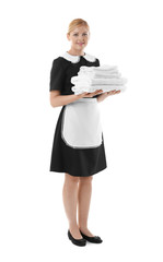 Beautiful chambermaid holding pile of clean towels on white background