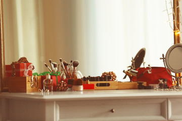 Cosmetics on table in room interior