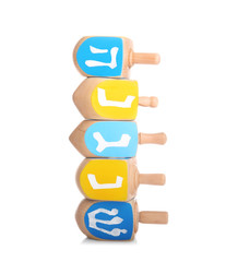 Obraz premium Wooden dreidels for Hanukkah on white background