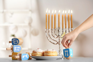 Beautiful composition for Hanukkah on grey table against blurred background
