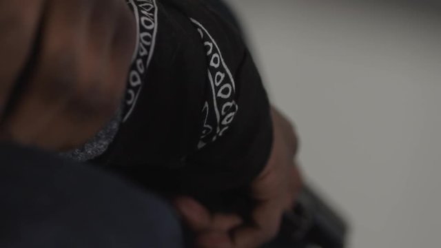 Hand_Holding_Pistol_Bandana.mov