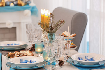 Table served for Hanukkah in living room, closeup