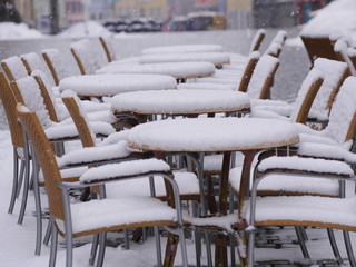 snowy chairs tables winter
