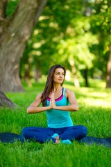 Fototapeta na wymiar Yoga woman on green grass 