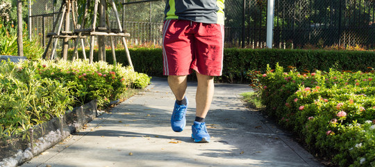 men running in a park.