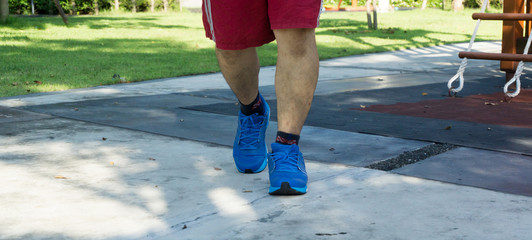 Men running in a park.