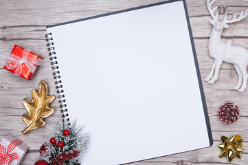 Christmas letter writing on white paper with decorations.