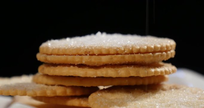 Falling sugar to biscuits.