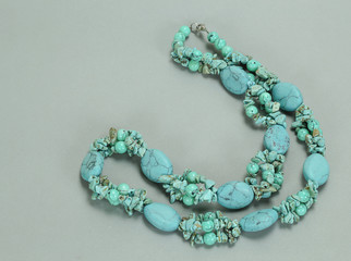 Natural turquoise on gray background