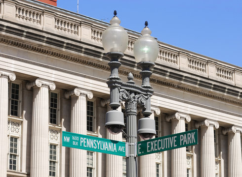 Pennsylvania Ave street sign on lamp against old building