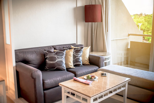 furniture set The cushions on the sofa Located along the window.