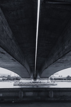 Fototapeta large concrete bridge construction vintage color tone,Shade shadow and light black and white photography concept.