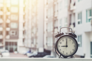 9 o'clock retro clock with The Clock condominium background.