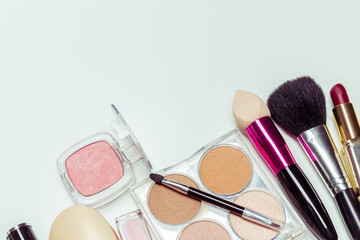 Brush and cosmetic isolated on a white background. Top view.