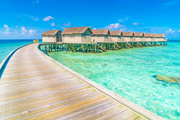 Beautiful water villas in tropical Maldives island  .