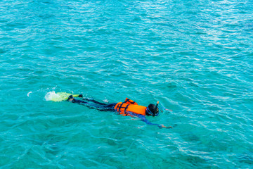 Snorkeling in tropical Maldives island .