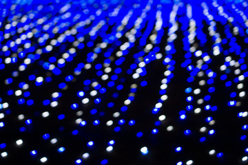 Blur blue bokeh from light in dark background, Blink blue abstract bokeh from small light in the night time 