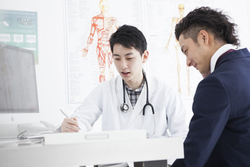 A businessman is undergoing a medical examination