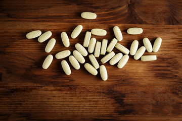 Fototapeta na wymiar Organic dietary treatment, vitamin capsules