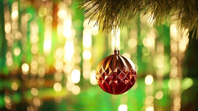 Footage with Christmas decorations. Beautiful Christmas background. Golden Ball on a Christmas tree