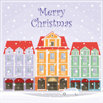 Christmas greeting card with a picture of snow-covered streets of the old town.