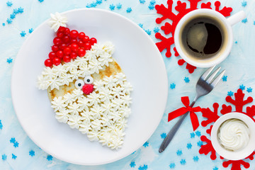 Christmas Santa Claus pancake with whipped cream and berry