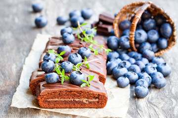 Chocolate  cake with chocolate cream and fresh blueberries