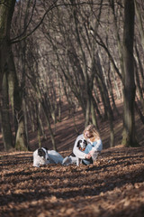 Young woman with two dogs outdoor
