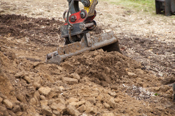 Fototapeta na wymiar shovel excavator in a garden