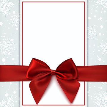 Blank greeting card with red bow and snow.