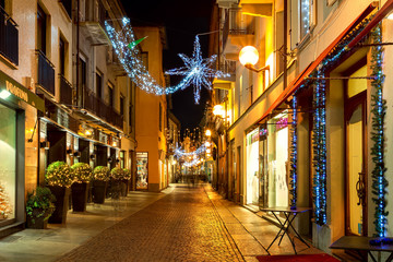 Fototapeta na wymiar Christmas decorations in Old Town of Alba, Italy.