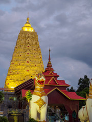 Buddha Khaya Stupa, golden pagoda at Wat Wang Wi Weh Karam in Sa - obrazy, fototapety, plakaty
