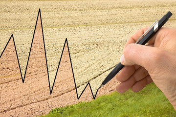 Hand write a graph in the background of a cultivated field
