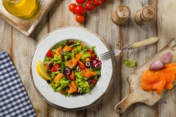 Fresh salad with smoked salmon.