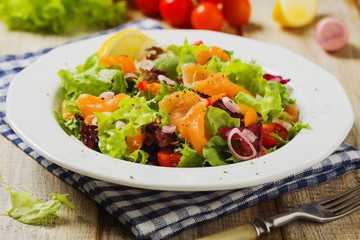 Fresh salad with smoked salmon.