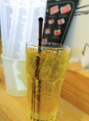 Ice Chrysanthemum tea on wood background, blure order food