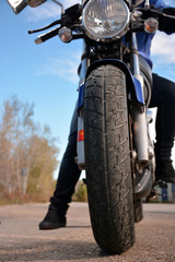 Naklejka premium biker with helmet blue going by a road