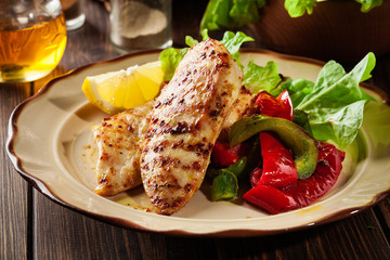 Grilled chicken breasts served with grilled paprika