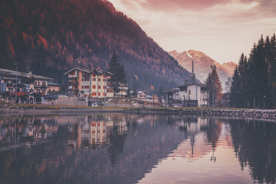 Sunset in the village in the Alpine mountains. Madonna di Campig