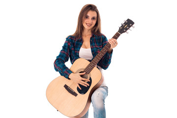 gorgeous girl with guitar in hands