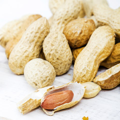 peanuts on a white wooden background