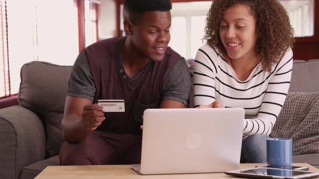 African American man and woman shop online