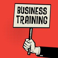 Poster in hand, business concept with text Business Training