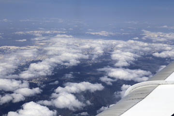 Fototapeta na wymiar View from window of a jet plane wing with beautiful weather