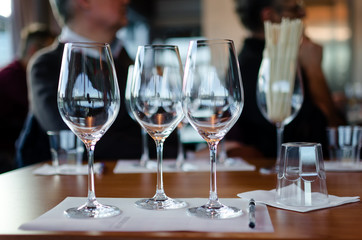 Table with glasses ready for wine tasting in a winery of Langhe (Italy)