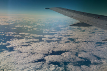 Obraz premium view from window of a jet plane wing with beautiful weather