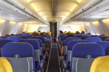 Fototapeta premium Interior passenger cabin with seats on the airplane