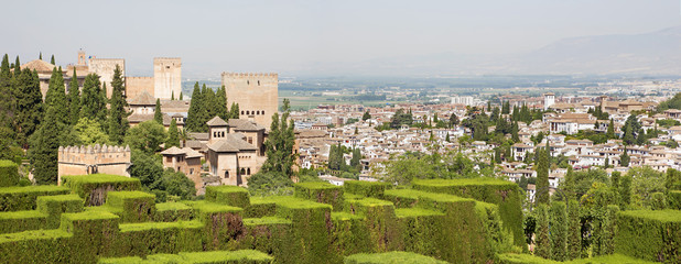 Fototapeta na wymiar Granada - The panorama of Alhambra and the town from Generalife gardens.